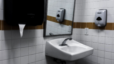 Person Drying Their Hands Under a Automatic Hand Dryer